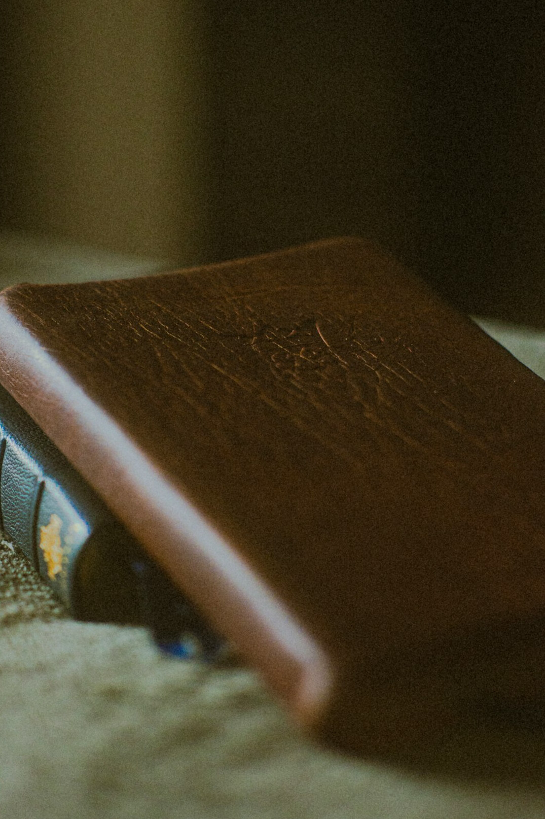 Notebook and pen on a wooden desk with coffee
