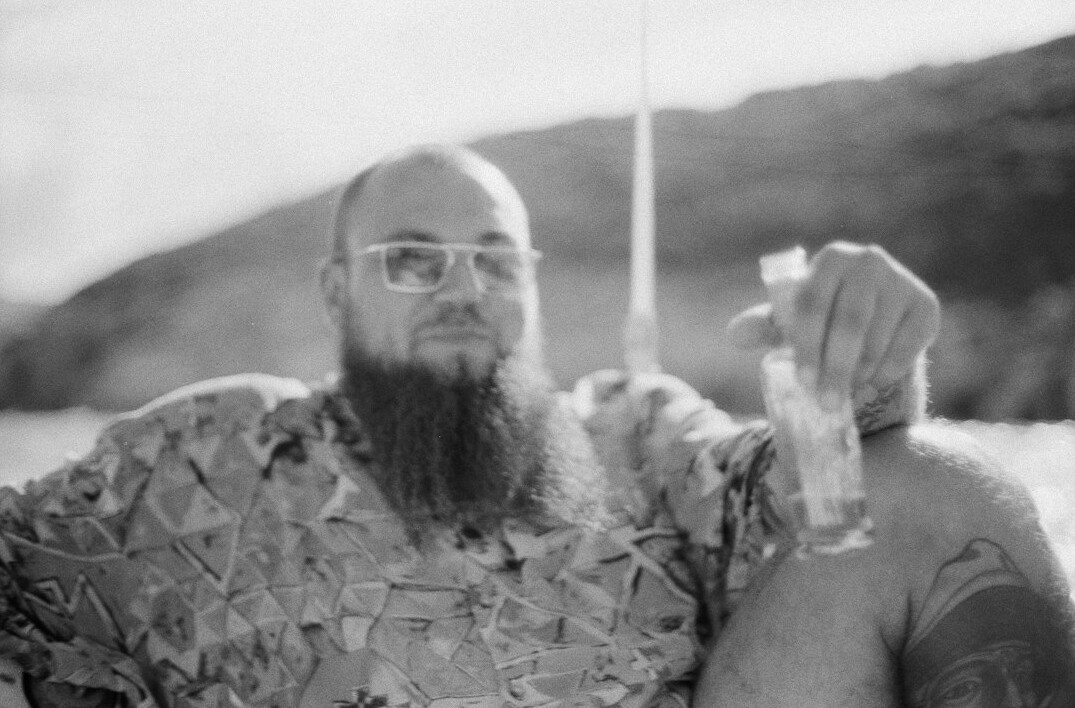 Portrait of a man with a beard and glasses