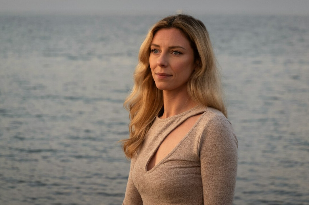 Portrait of a blonde woman in a light sweater